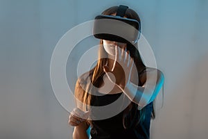 Virtual reality and the digital world. Girl gamer in VR glasses