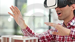 Virtual reality futuristic design technology. Architect or design engineer in VR headset for BIM technology designing a