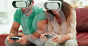 Virtual reality, glasses and couple playing game online with controller while sitting on the sofa. Technology, metaverse