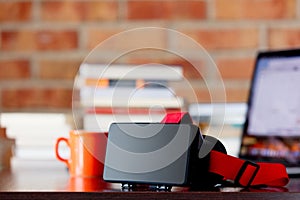 Virtual reality glasses on a table with laptop computer