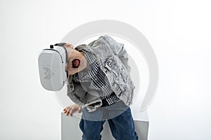 Virtual reality glasses on a young boy in shock. Fun with 3D glasses