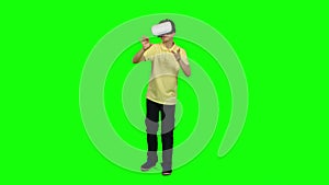 Virtual reality mask. Ghild uses head-mounted display. Green screen