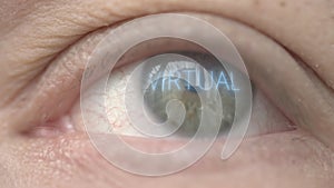 VIRTUAL word on human eye. Modern biotechnology related macro shot