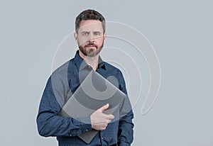 Virtually connected. Unshaven man hold laptop. Online courses. Online ccommunication