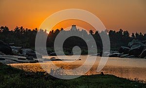 Virupaksha Temple hampi india karnakata at sunset with the river colorful