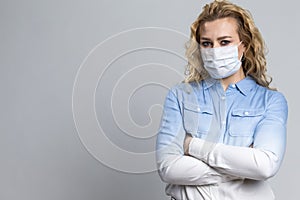 Virus Ideas. Concept of Coronavirus of Depressed Caucasian Woman Wearing Flu Virus Mask For Viral Prevention. Against Gray