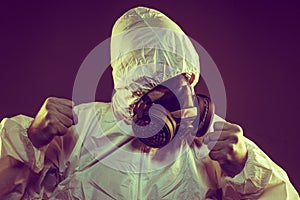 virus infection concept. Man in protective suit and antigas mask