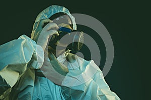virus infection concept. Man in protective suit and antigas mask photo