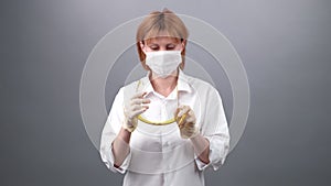 Virus protection. close-up the face of a doctor woman in a medical cap, puts on face mask and protective glasses on her eyes. 2019