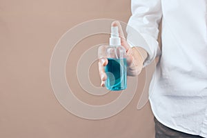 Virus protection, Person holding an alcohol spray.