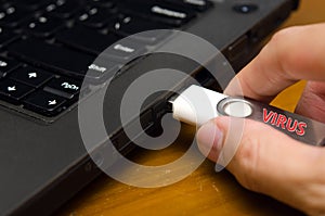 Virus USB thumb drive plug in to laptop computer port