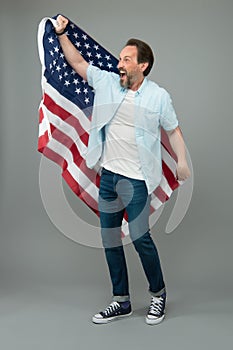 Visa free. Happy man get USA visa grey background. Visa applicant hold usa flag. Applying for immigrant visa to american