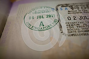 Visa stamp, visum in a passport, shallow focus. Traveling concept