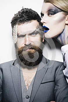 Visage course. Sensual woman and bearded man with creative makeup, visage course. Visage course of professional makeup