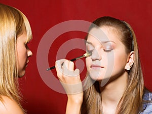 Visage - young women over red background