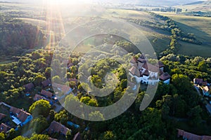 Viscri saxon church in the traditional village of Viscri, Romania. UNESCO site - drone view