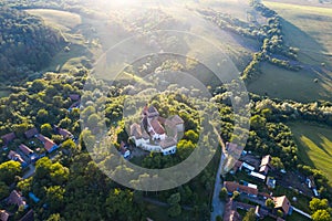 Viscri saxon church in the traditional village of Viscri, Romania. UNESCO site - drone view