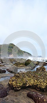 visible Mountains, rocks, clouds and oceans