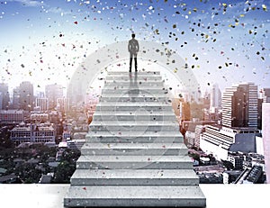 Vision concept. Successful businessman standing on staircase, on to celebrate and looking over city