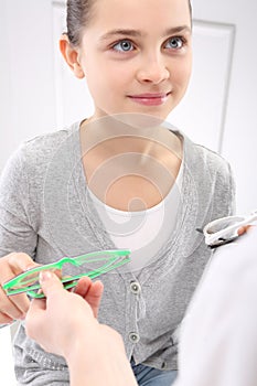 Vision test, a child an ophthalmologist