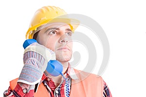 Visionary and confident builder using phone