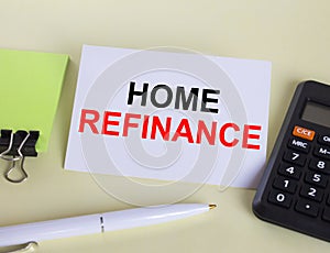 Visit card with text Home Refinance laying with white pen