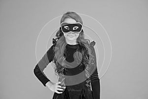 Visit public event anonymously. Winter new year party. Winter carnival. Masquerade concept. Kid wear eye mask. Girl wear photo