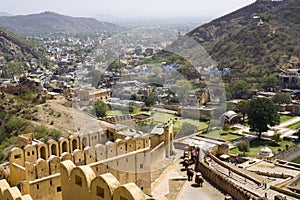 Visiting Amber Fort in the city of Jaipur - India by elephant, sitting on the elephant`s back to discover the famous Amber Fortres