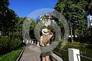 Visiting Belo Horizonte, Brazil. Back view of young woman in the Municiapl Parque Americo Renne Giannetti, a city park in Belo photo