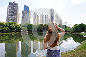 Visiting Goiania, Brazil. Rear view of beautiful girl in the Parque Areiao, a city park in Goiania, Goias, Brazil