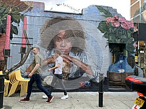 Giant graffiti art on the streets of Brick Lane, East London Uk