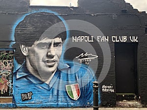 Giant graffiti art of the legendary Maradonna on the streets of Brick Lane, East London Uk