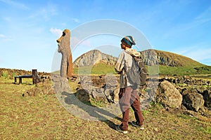 Visitor Being Impressed by Moai A Vere Ki Haho or Traveling Moai, a Solitary Moai at the entrance of Ahu Tongariki, Easter island