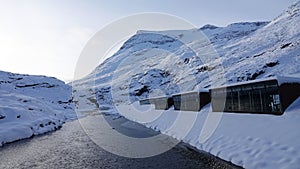 Visitor centre on Trollstigen in snow in Norway in autumn