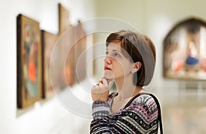 Visitor looking pictures in art gallery