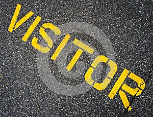 Visitor Stenciled Sign on Asphalt