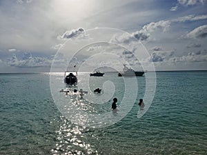 Visitors enjoy late afternoon off Radio Beach in North Bimini, Bahamas.