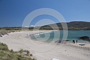 Visitors enjoy white sand beach at Caherdaniel, County Kerry