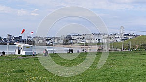 Visitors enjoying the sun at Portrush Beach N Coast Co Antrim Northern Ireland 29-05-22