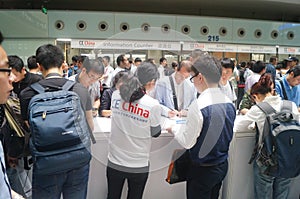 Visitors fill out personal information into the exhibition hall