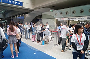 Visitors fill out personal information into the exhibition hall