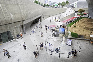 Visitors outside Dongdaemun Design Plaza, Seoul, South Korea