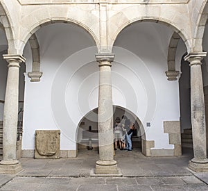 Visitors at Palace of Weathervanes Courtyard, Caceres, Spain