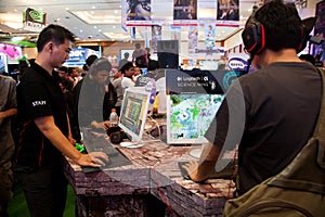 Visitors Playing Video Games at Indo Game Show 2013