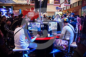 Visitors Playing Video Games at Indo Game Show 2013