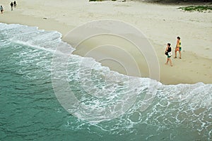 Visitors on sandy beach of Kerachut Beach.