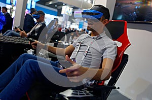 Visitors testing VR devices experiences in MWC 2019 side view