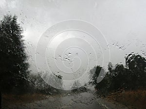 Vista de la carretera con lluvia y viento, desde el automÃÂ³vil photo