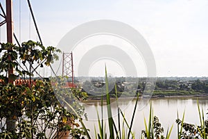 Vista del Puente Billinghurst (Puente Intercontinental) cruzando RÃÂ­o Madre de los DIos, Puerto Maldonado, Per photo