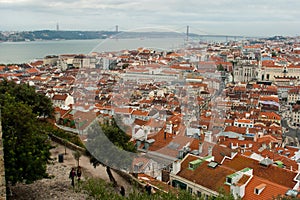 Vista over Lisbon's Baixa area, the Tagus river, the Cristo Rei statue and 25 de Abril Bridge